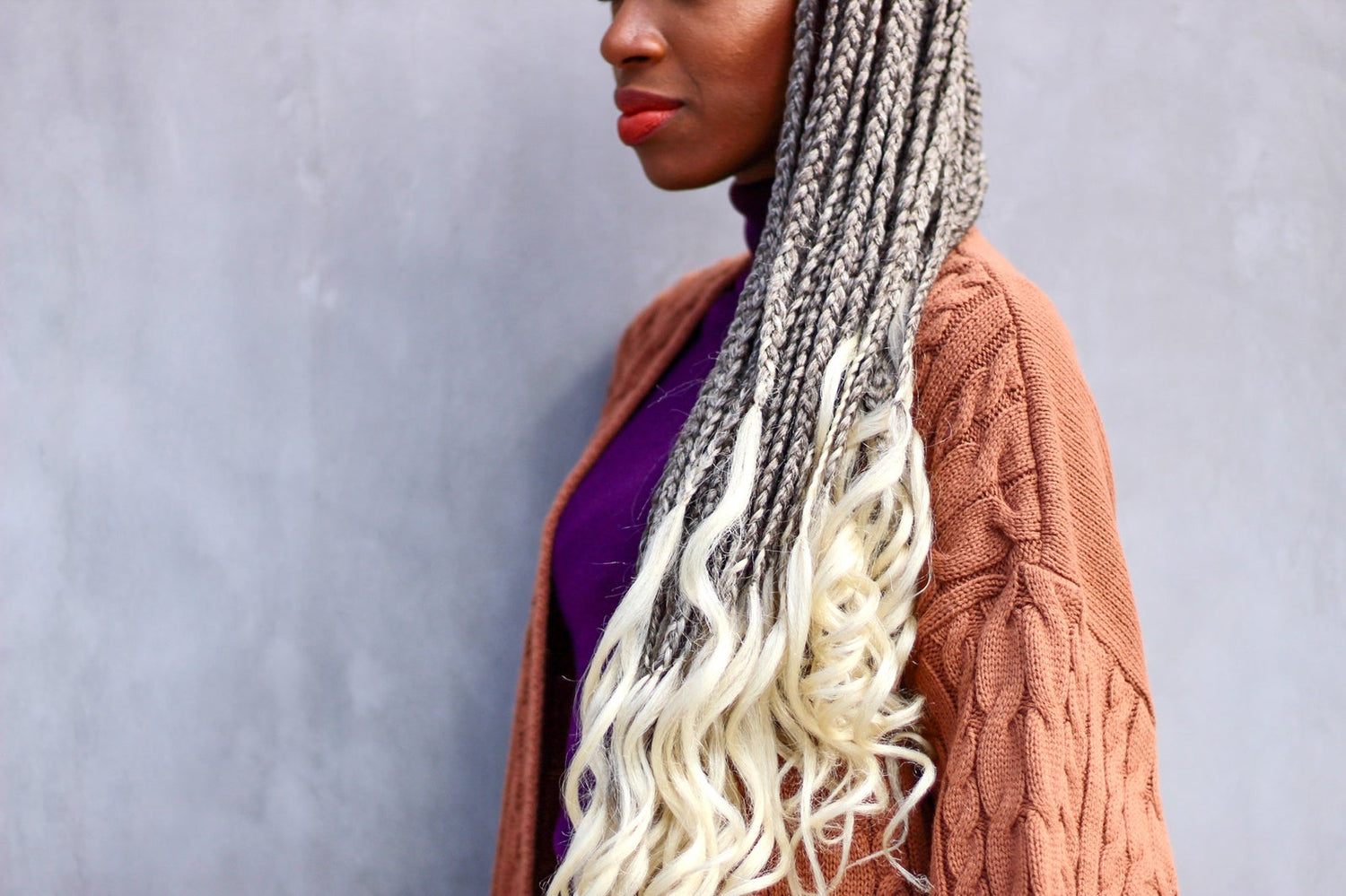 Woman with fresh colorful braids, a complete wash day guide for frizz-free braids
